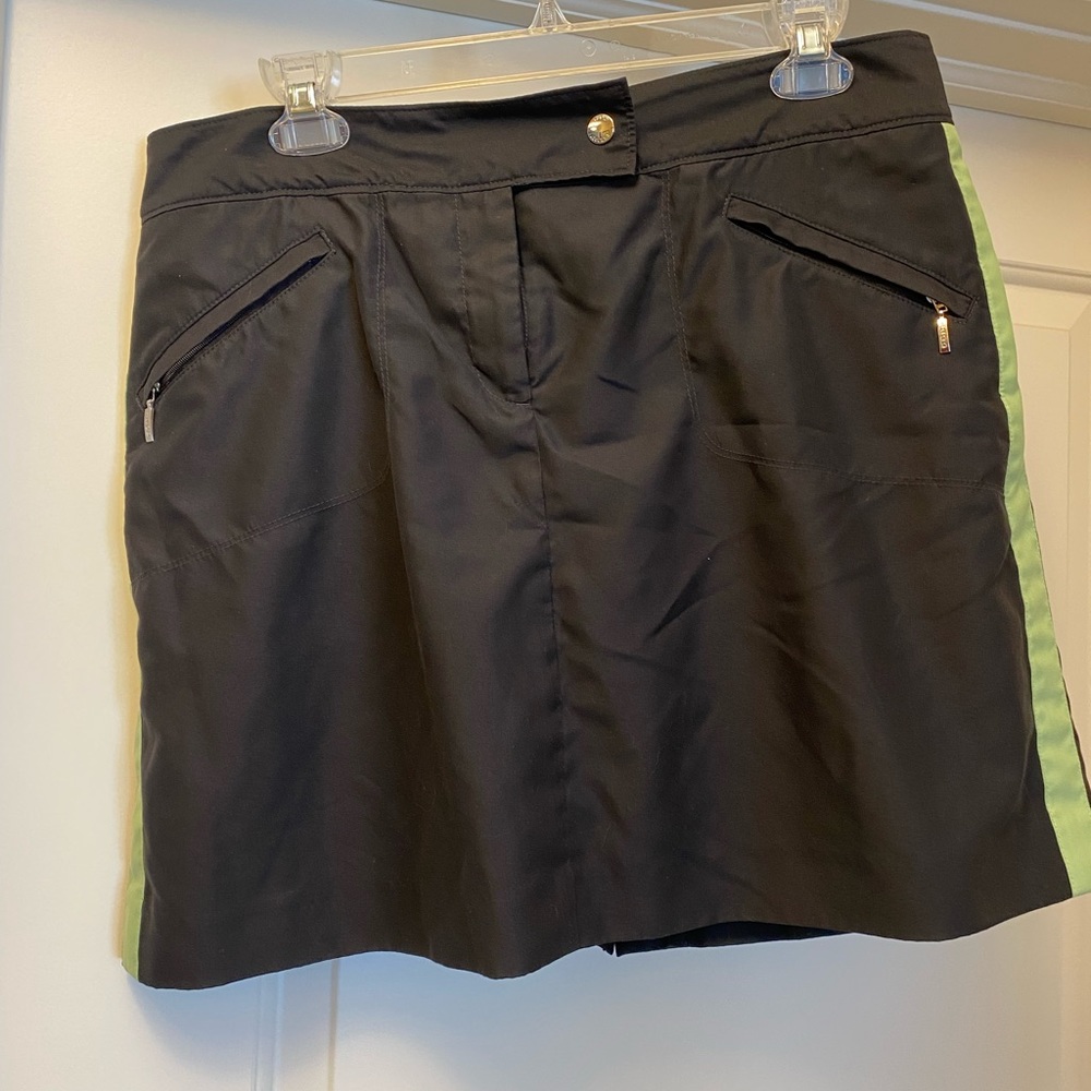 Izod golf outfit with two tops.  Black, green and white.
